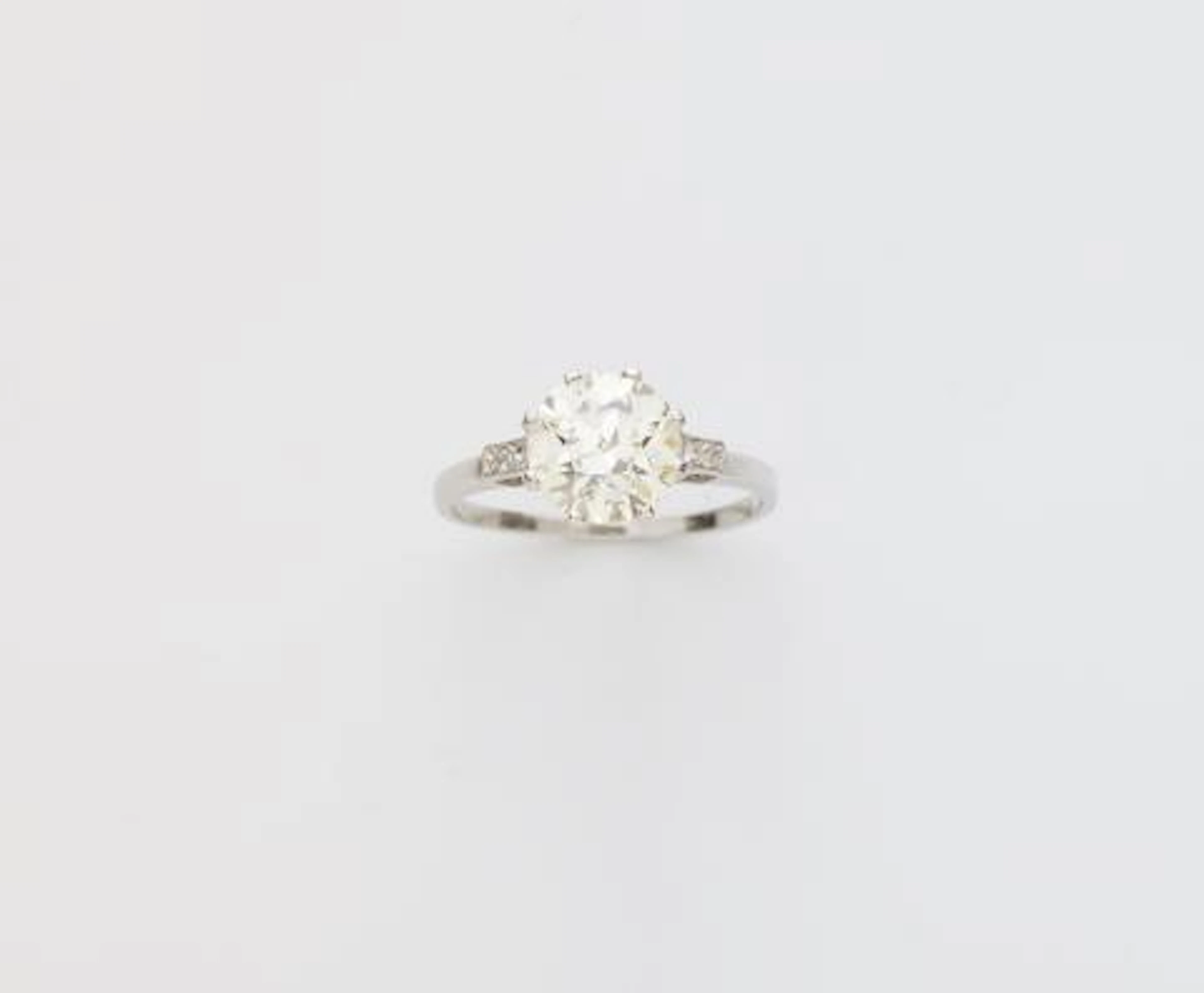 A platinum and transitional-cut diamondArt Déco solitaire ring.