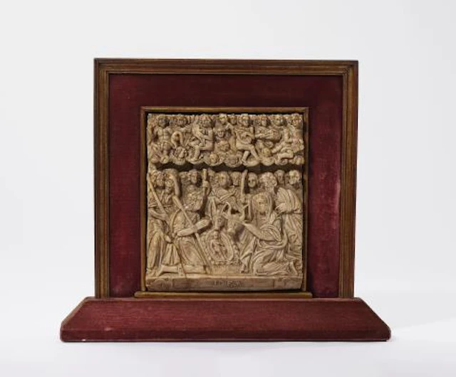 A carved alabaster relief with the Adoration