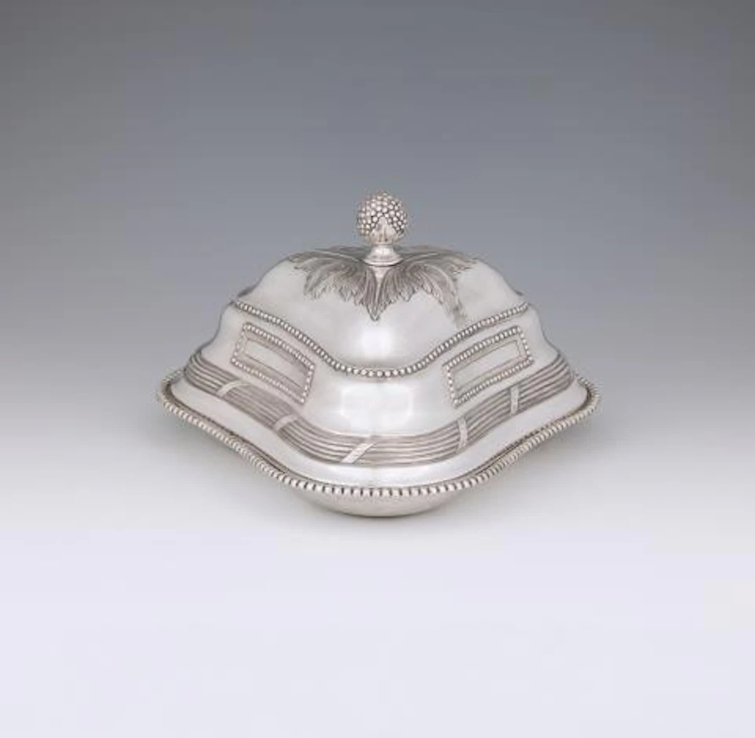 A Polish triangular dish with a warming cloche