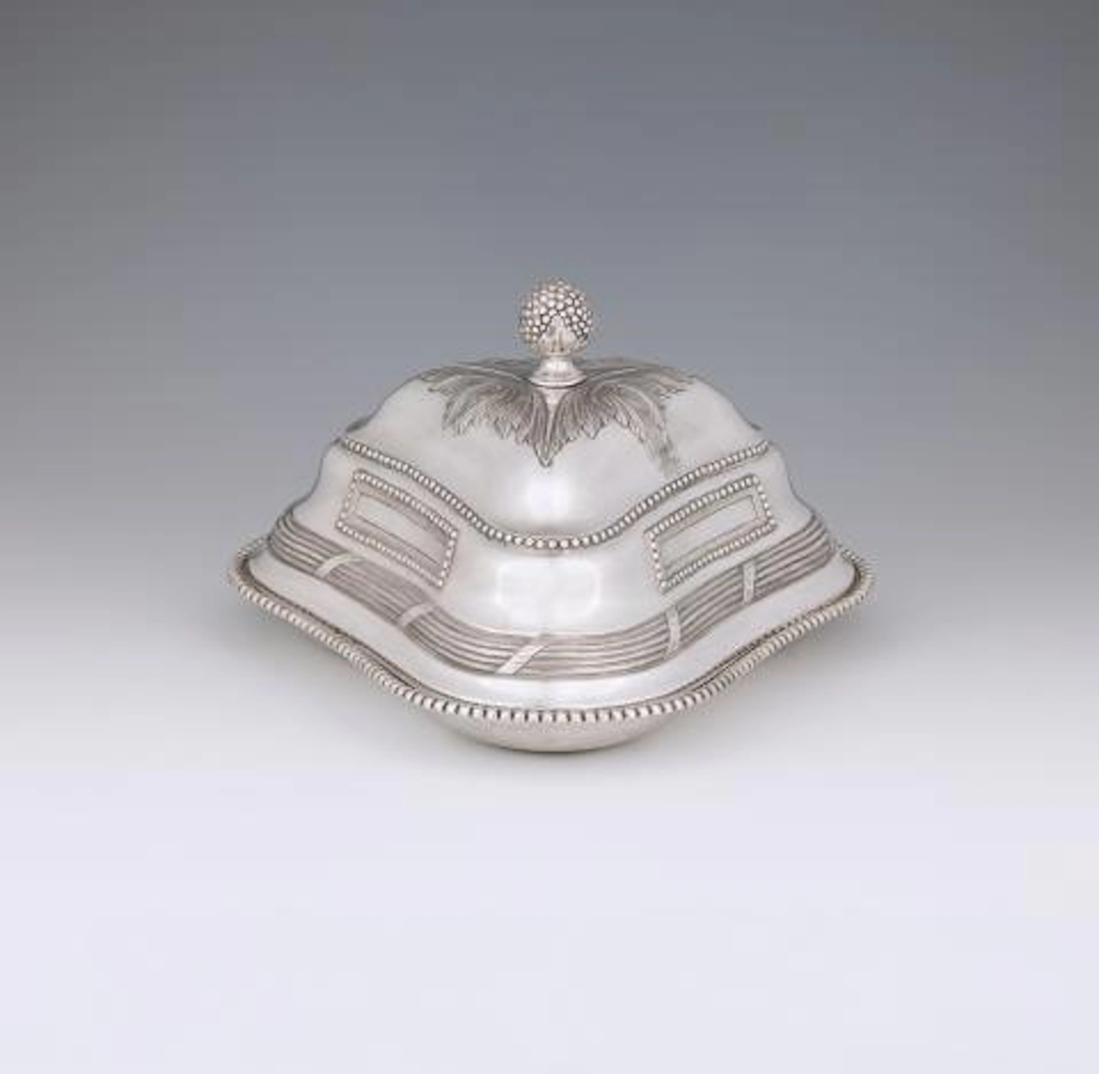 A Polish triangular dish with a warming cloche