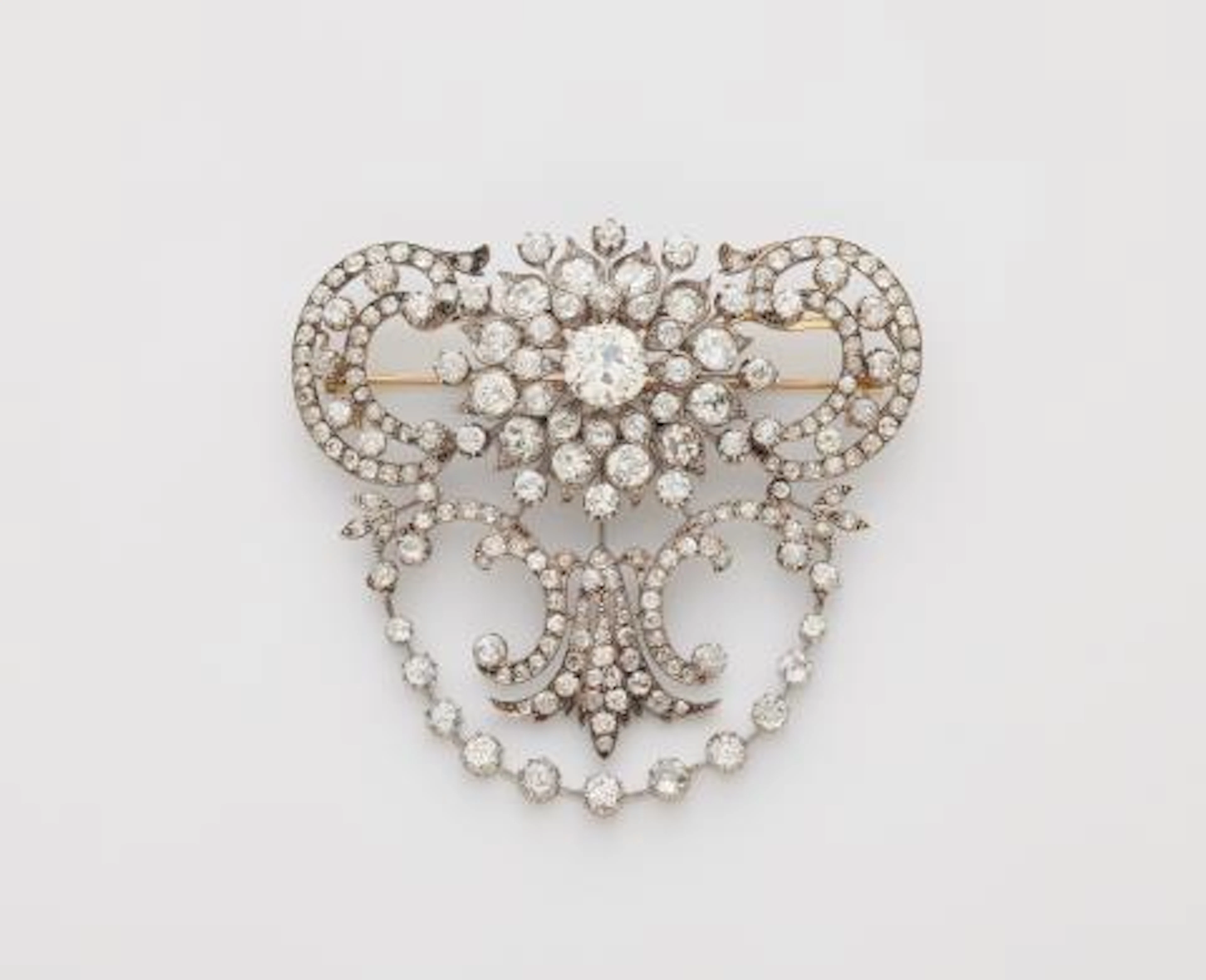 An important silver 14k gold and diamond Belle Epoque stomaker brooch.