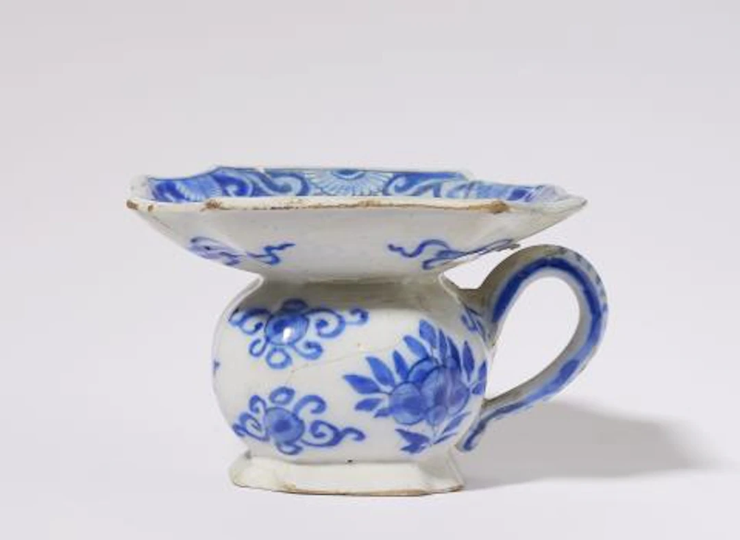A small Dutch Delft faience spitoon