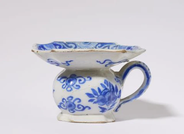 A small Dutch Delft faience spitoon