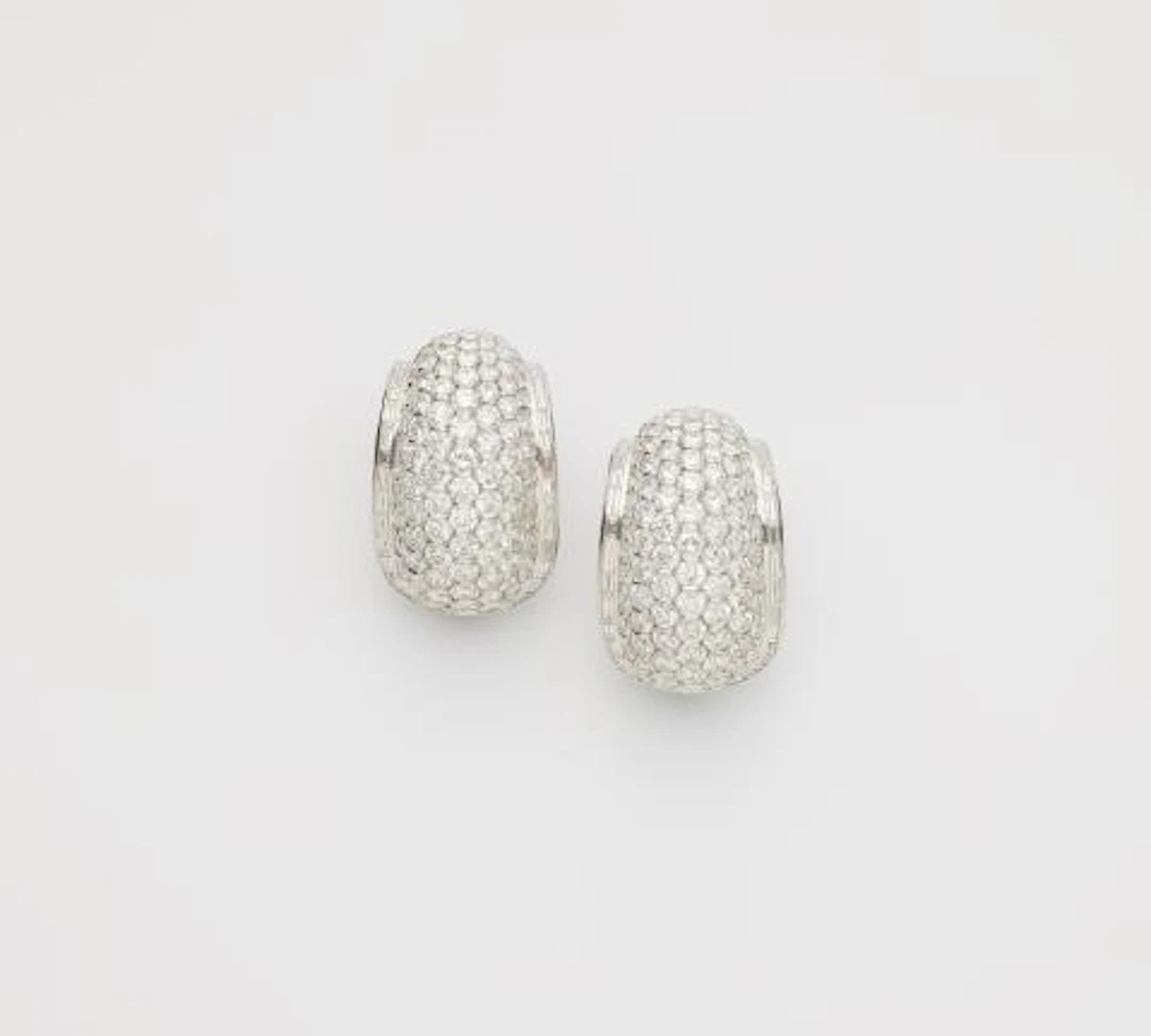 A pair of Italian 18k white gold and diamond cocktail creole clip earrings.
