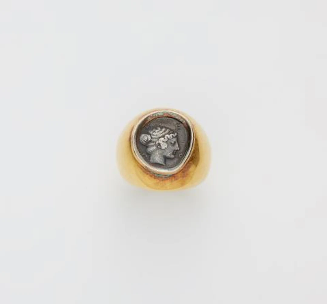 A German chased 18k gold ring with an ancient Hellenistic Triobol
