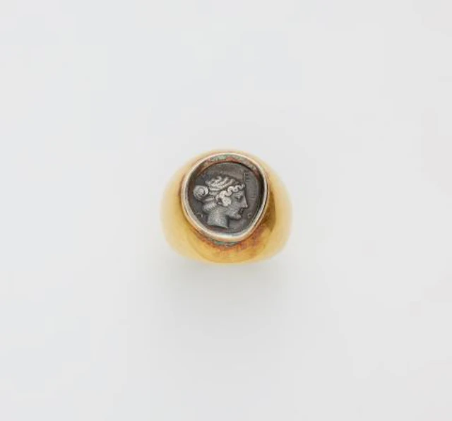 A German chased 18k gold ring with an ancient Hellenistic Triobol