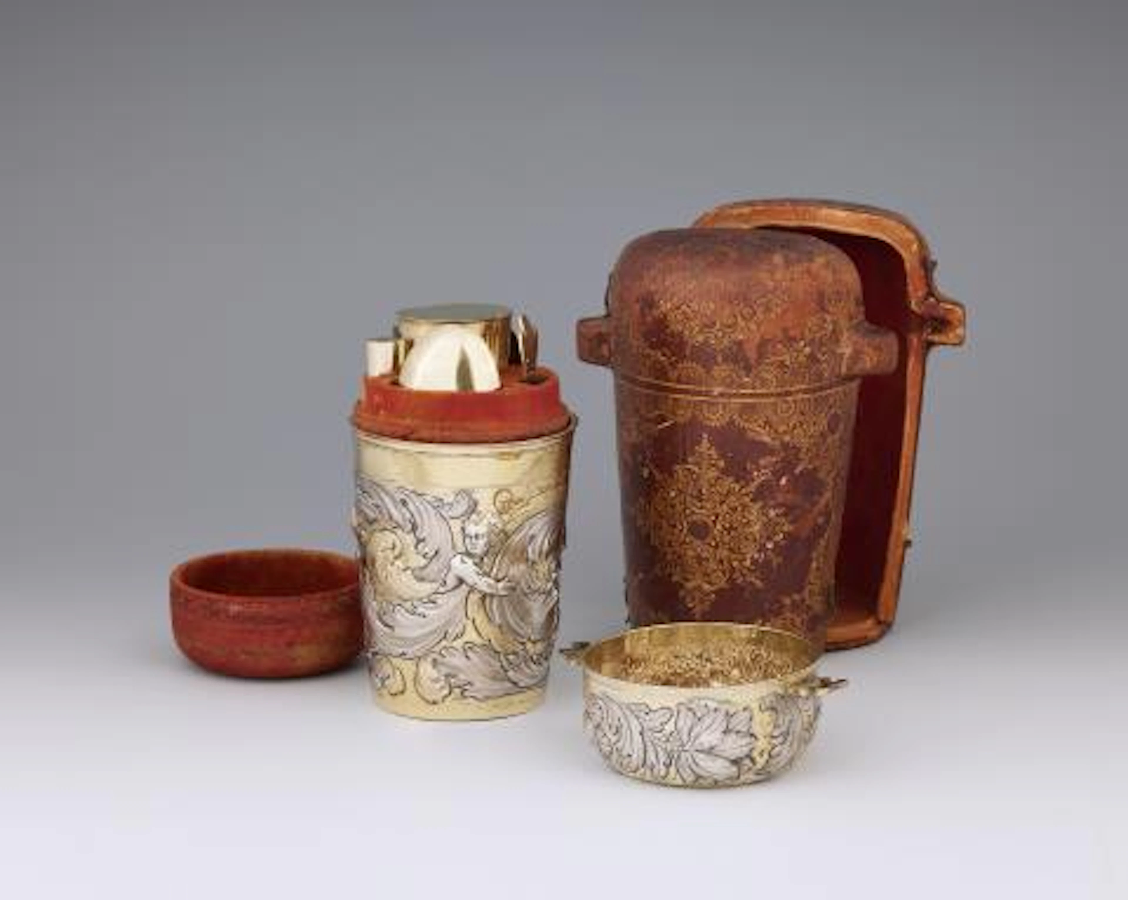 A museum-quality Augsburg silver gilt travel cutlery set in a leather case