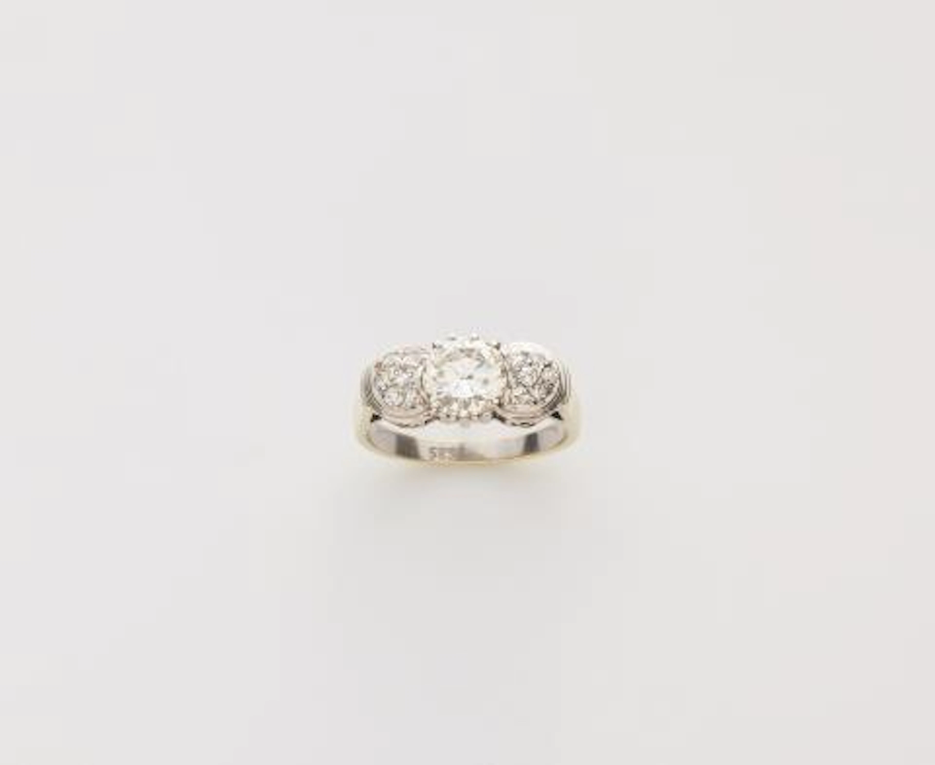 A rhodinated 14k yellow gold and diamond ring.