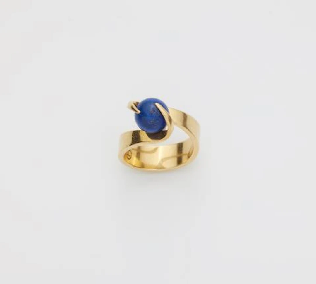 A German 18k yellow gold ring with interchangeable lapis lazuli sphere.