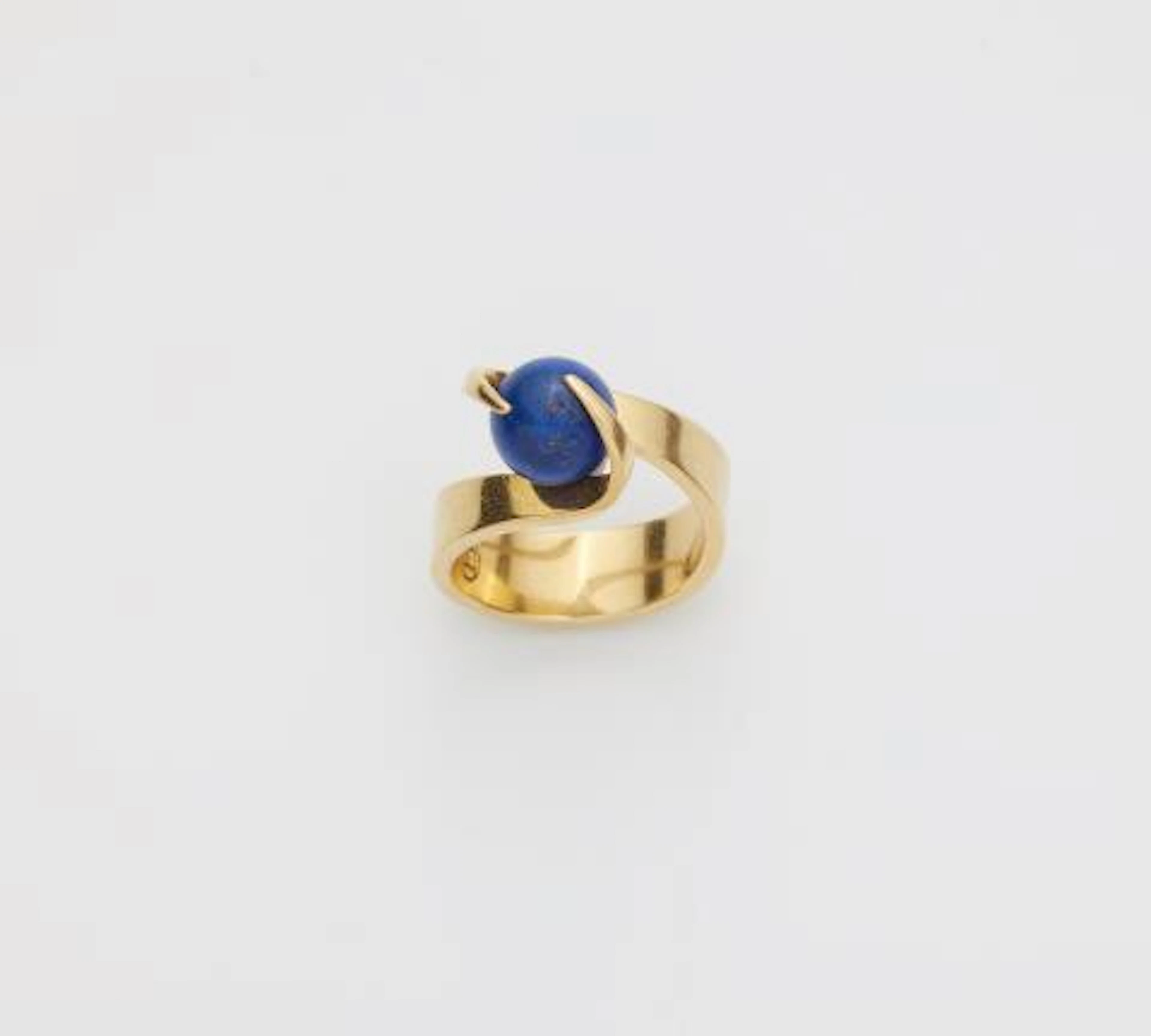 A German 18k yellow gold ring with interchangeable lapis lazuli sphere.
