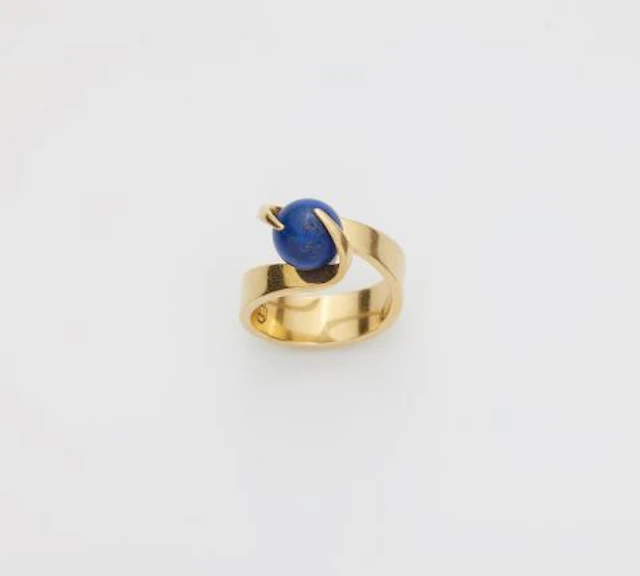 A German 18k yellow gold ring with interchangeable lapis lazuli sphere.
