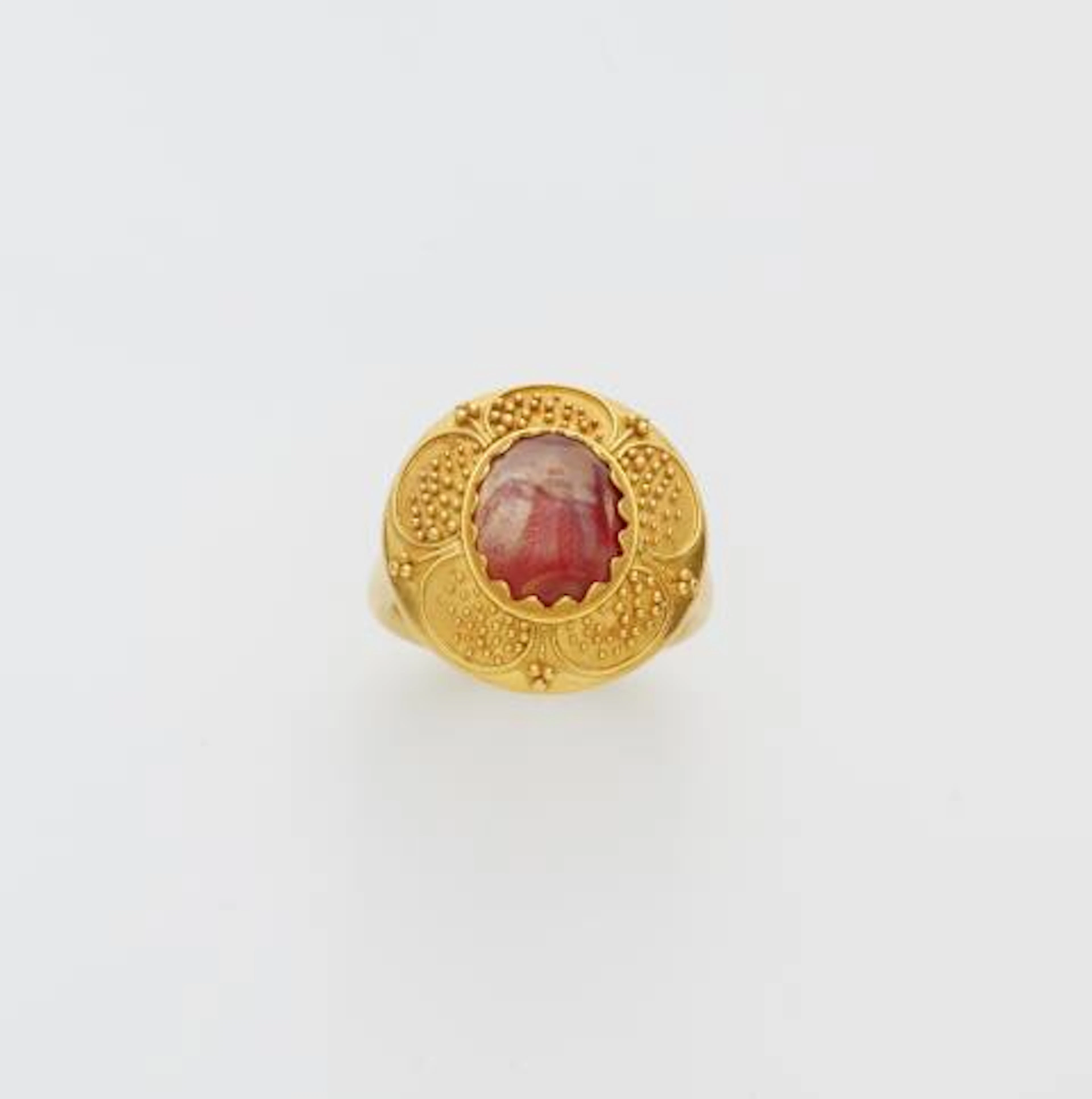 A German 18k gold granulation and ancient Roman carnelian intaglio ring.