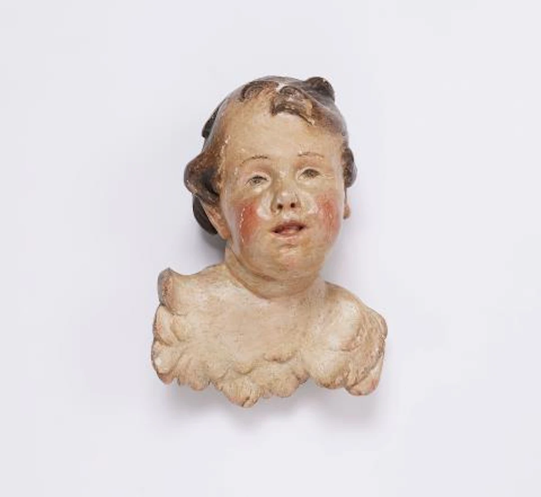 A winged angel's head