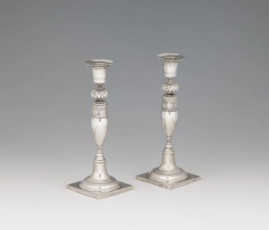 A pair of small Berlin silver candlesticks