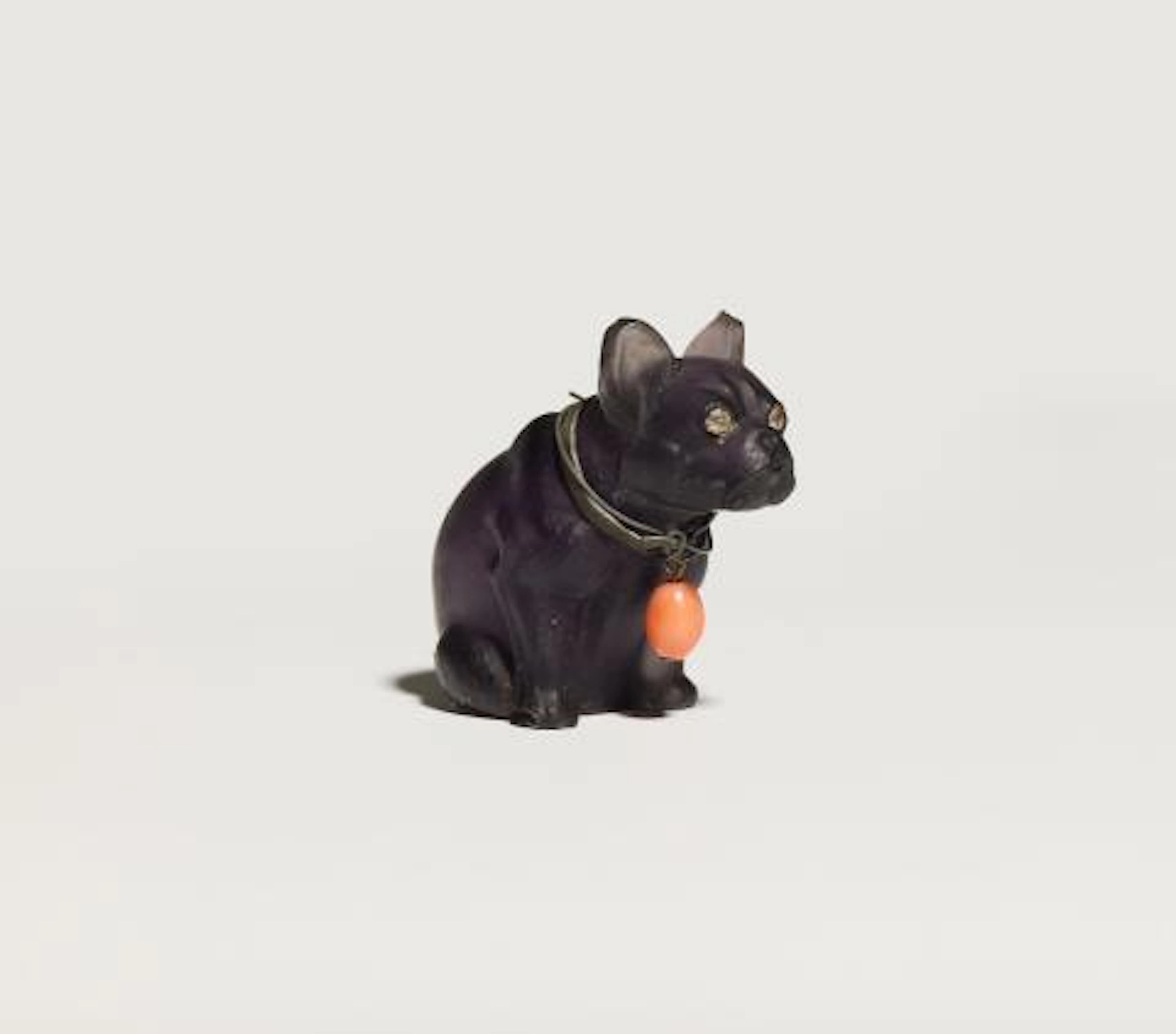 A frosted carved amethyst model of a sitting bull terrier wearing