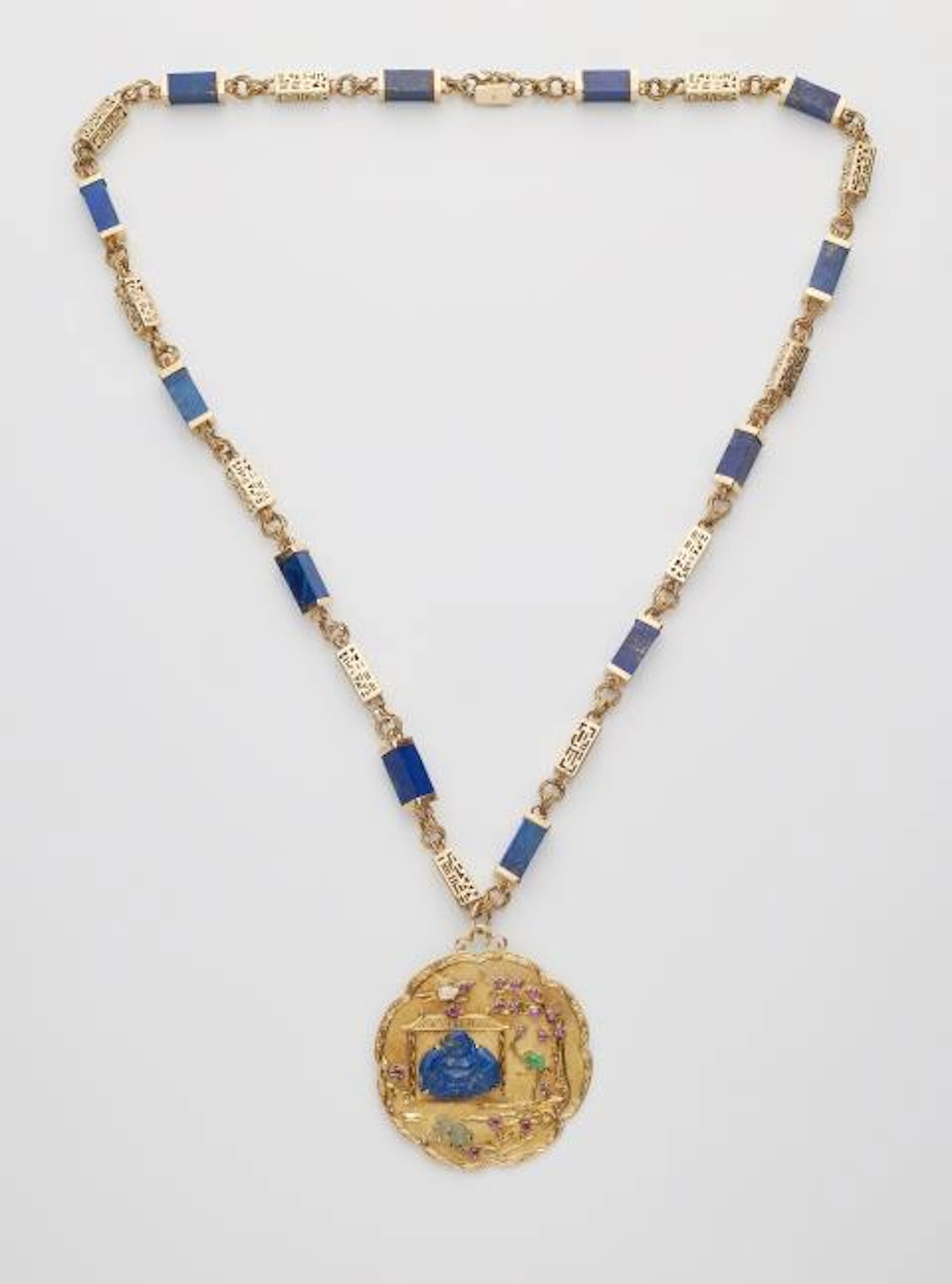 An 18k gold lapis lazuli sautoir necklace with a large textured 18k