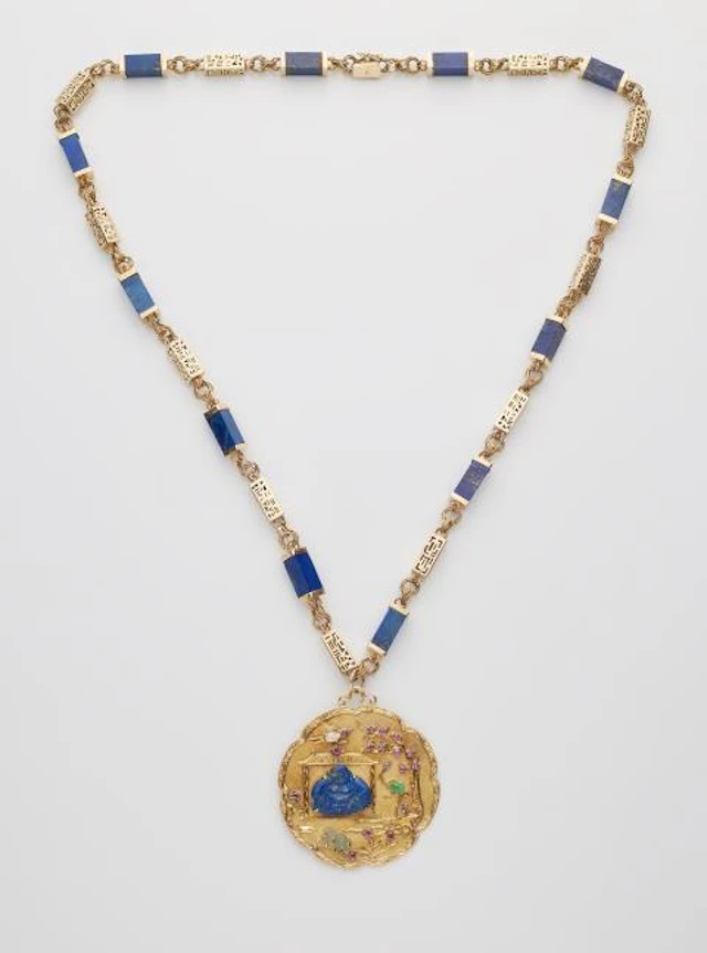 An 18k gold lapis lazuli sautoir necklace with a large textured 18k