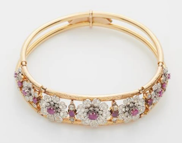 An 18k two colour gold old-cut diamond and ruby Retro Style neck bangle.