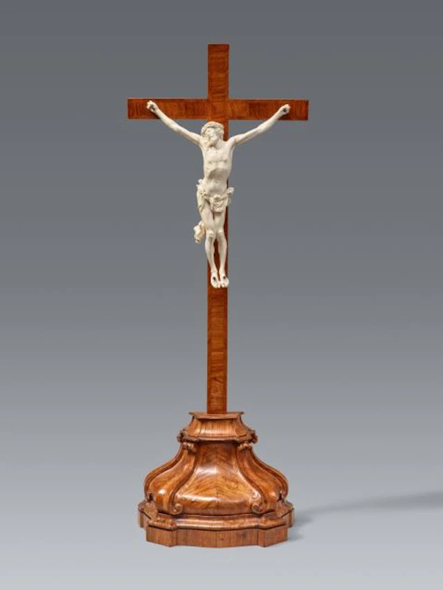 A rosewood veneered altar cross with a carved ivory Corpus Christi