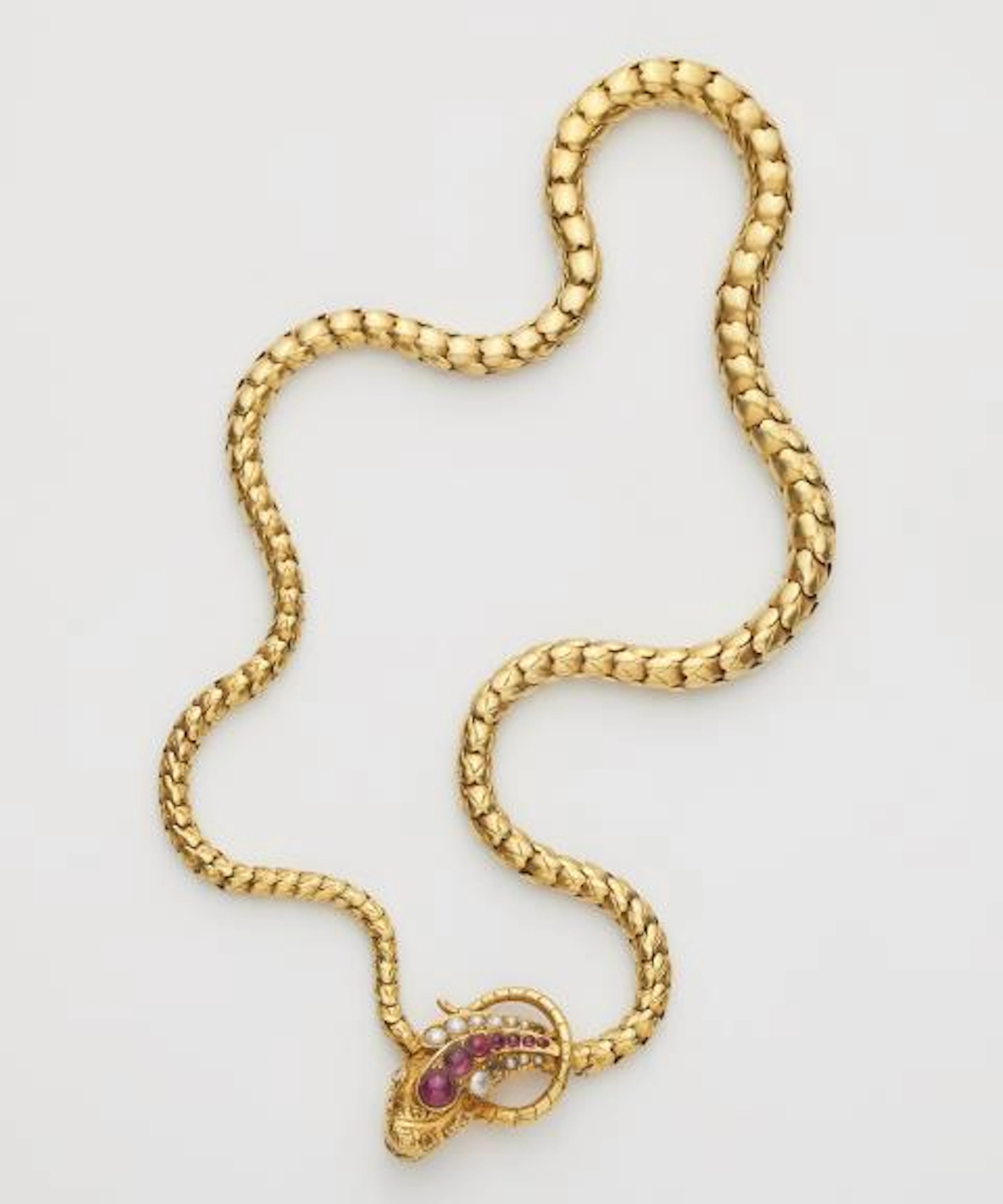 A Victorian 14k yellow gold ruby pearl and diamond snake necklace.