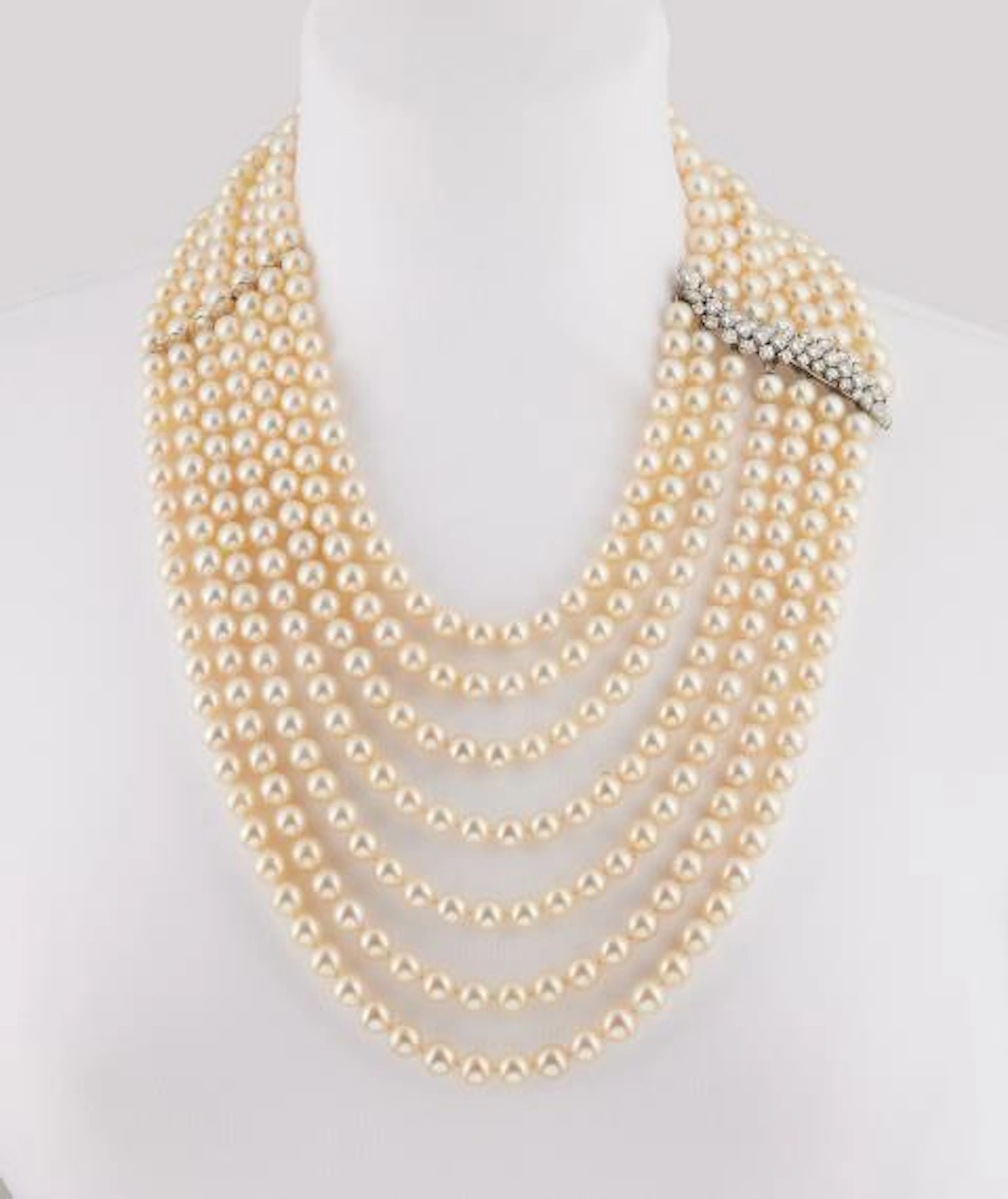 An opulent seven row cultured pearl waterfall necklace with an 18k