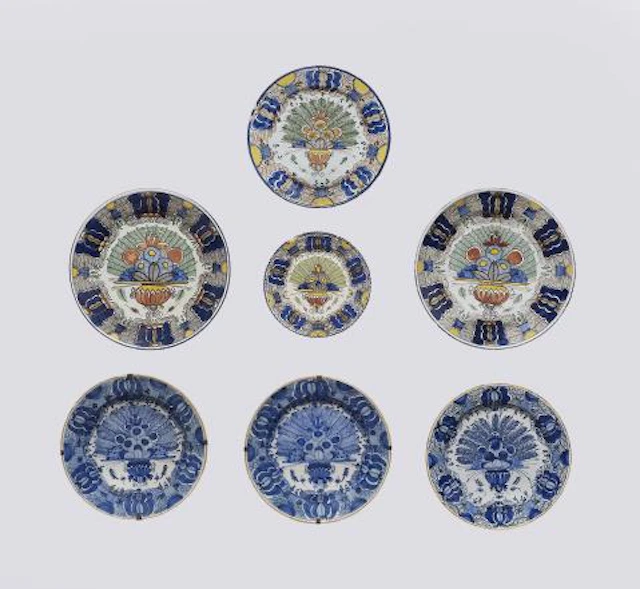 Six Dutch Delft faience dishes with peacock motifs