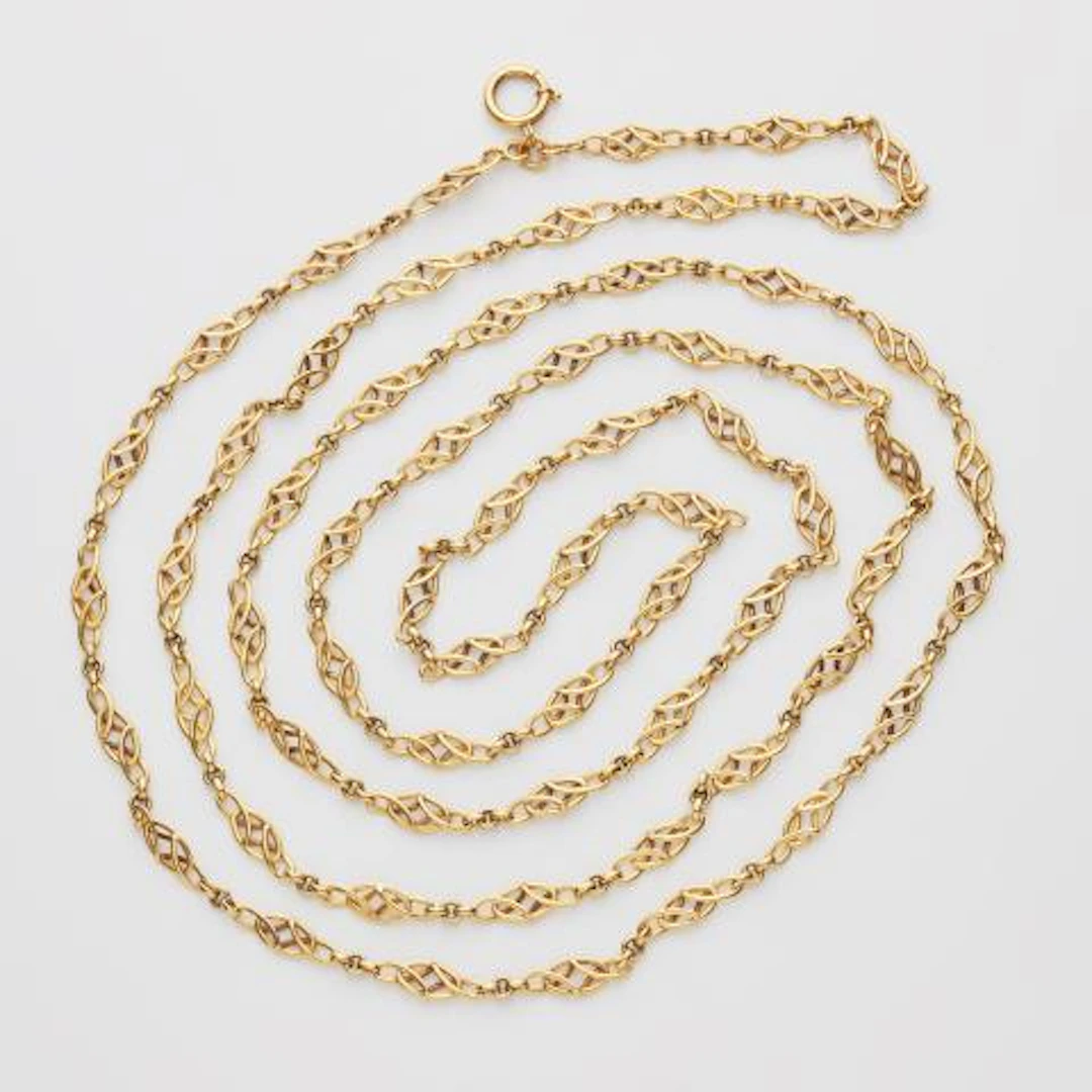 A long 14k gold Art Nouveau sautoir chain.
