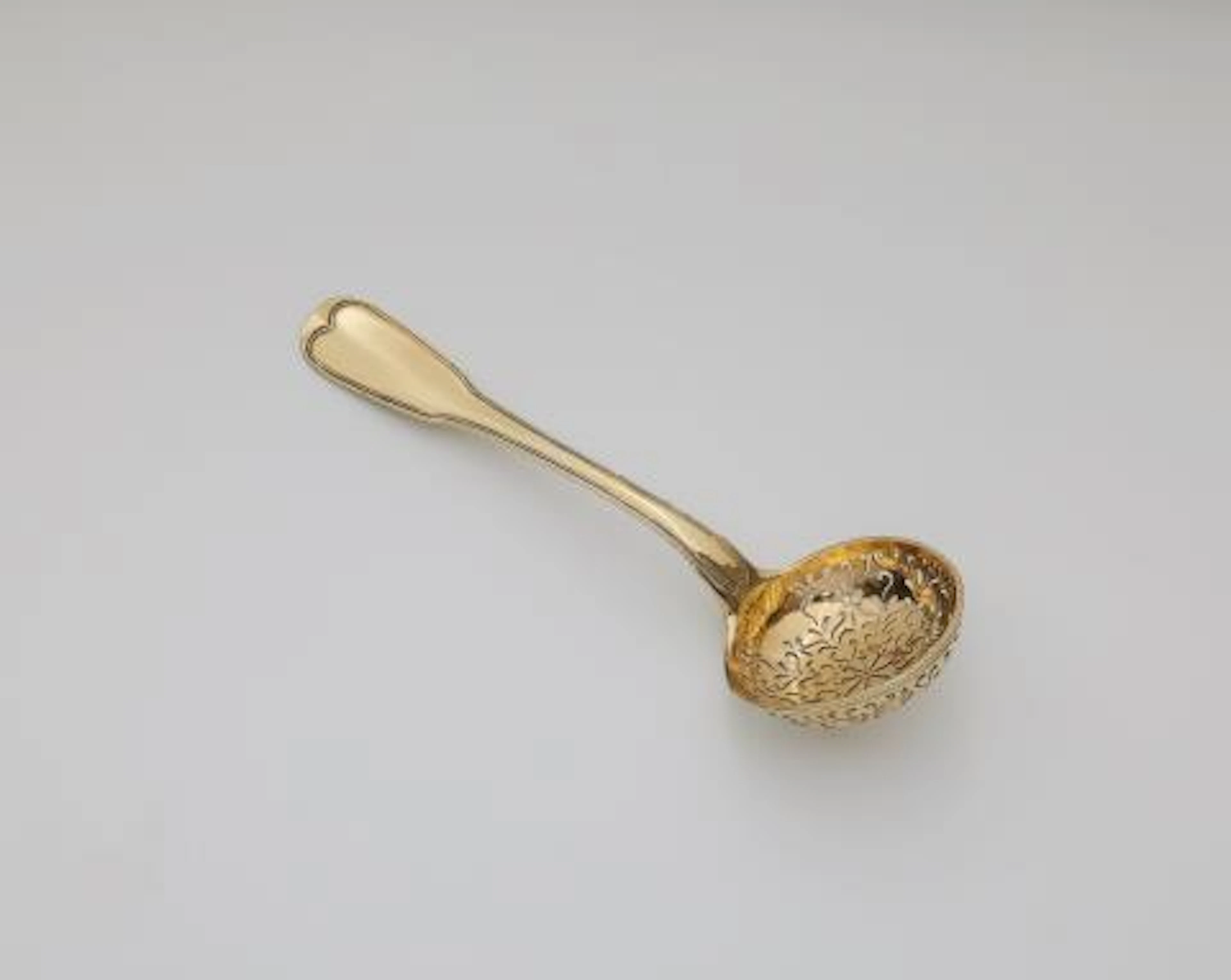 A Strasbourg silver gilt sifter spoon