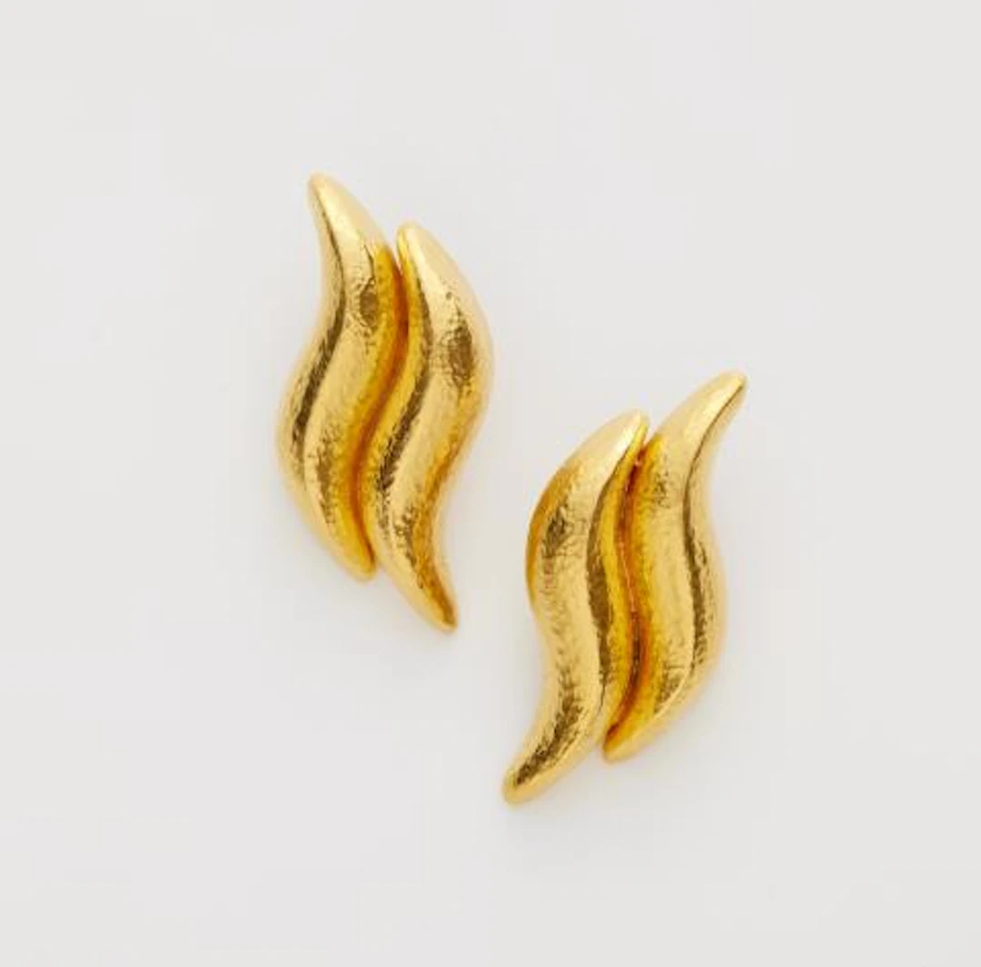 A pair of hammered 18k yellow gold clip earrings.