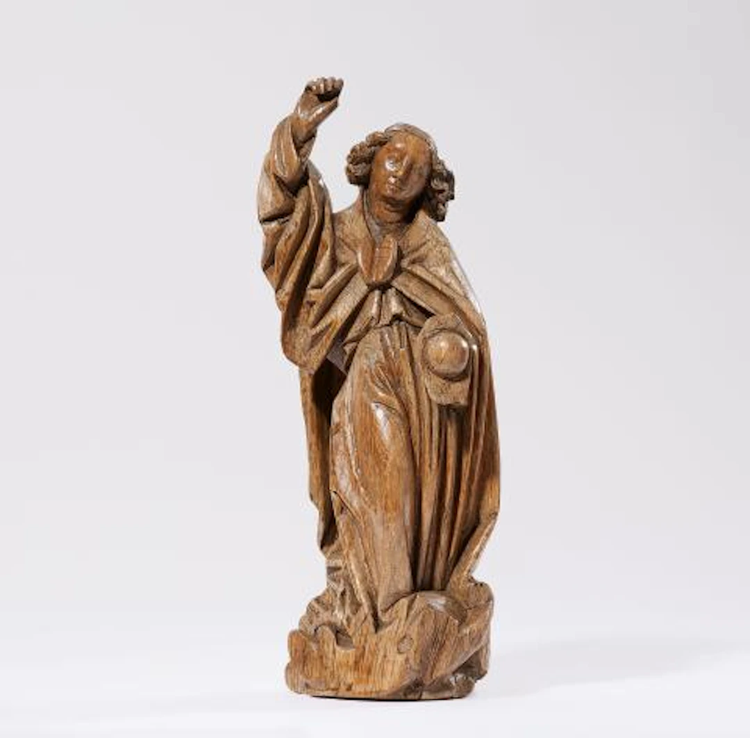 A carved oak figure of St. Michael