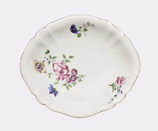 A Strasbourg faience dish with finely painted flowers