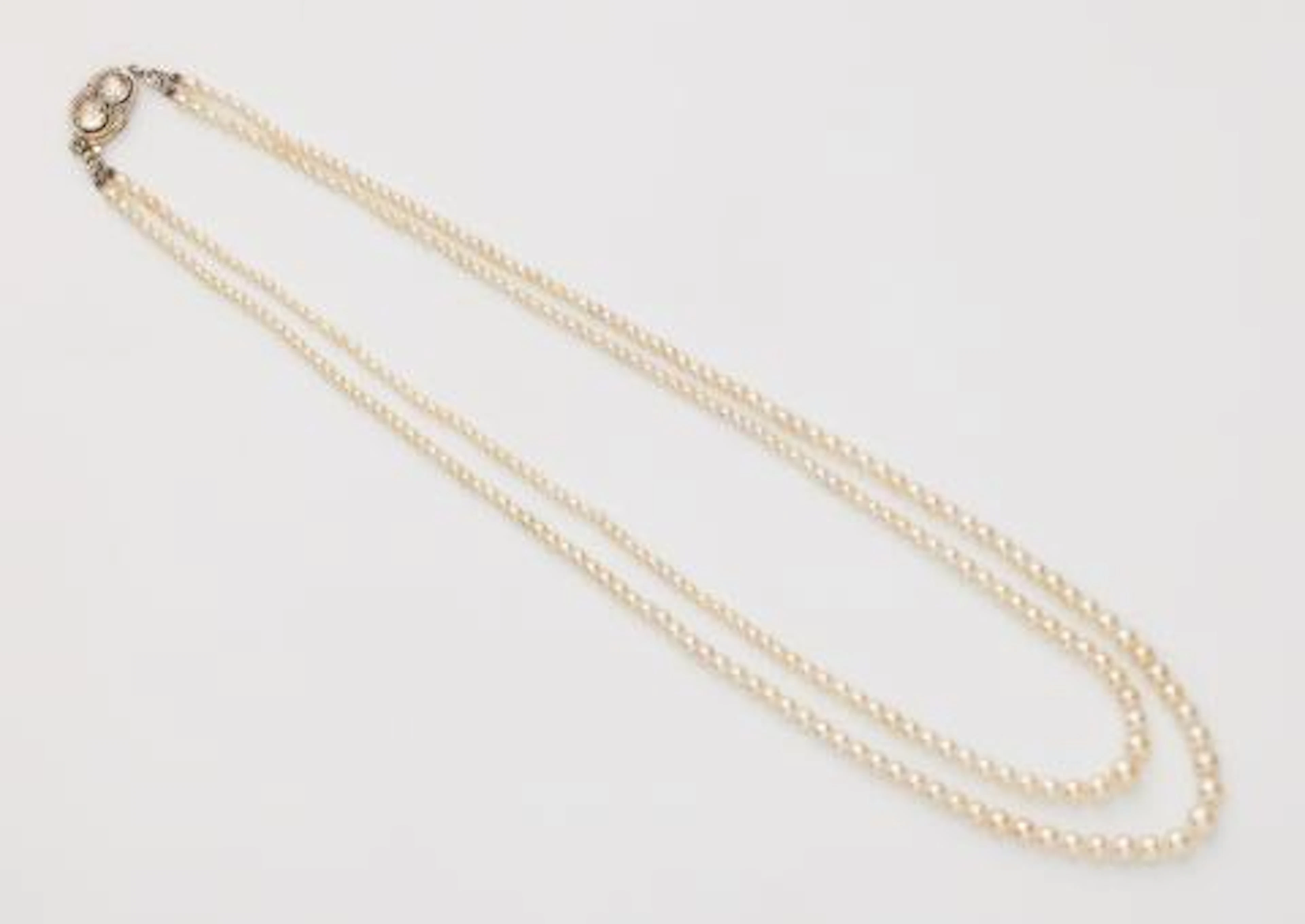 A Belle Epoque two row Oriental pearl necklace with a platinum 14k