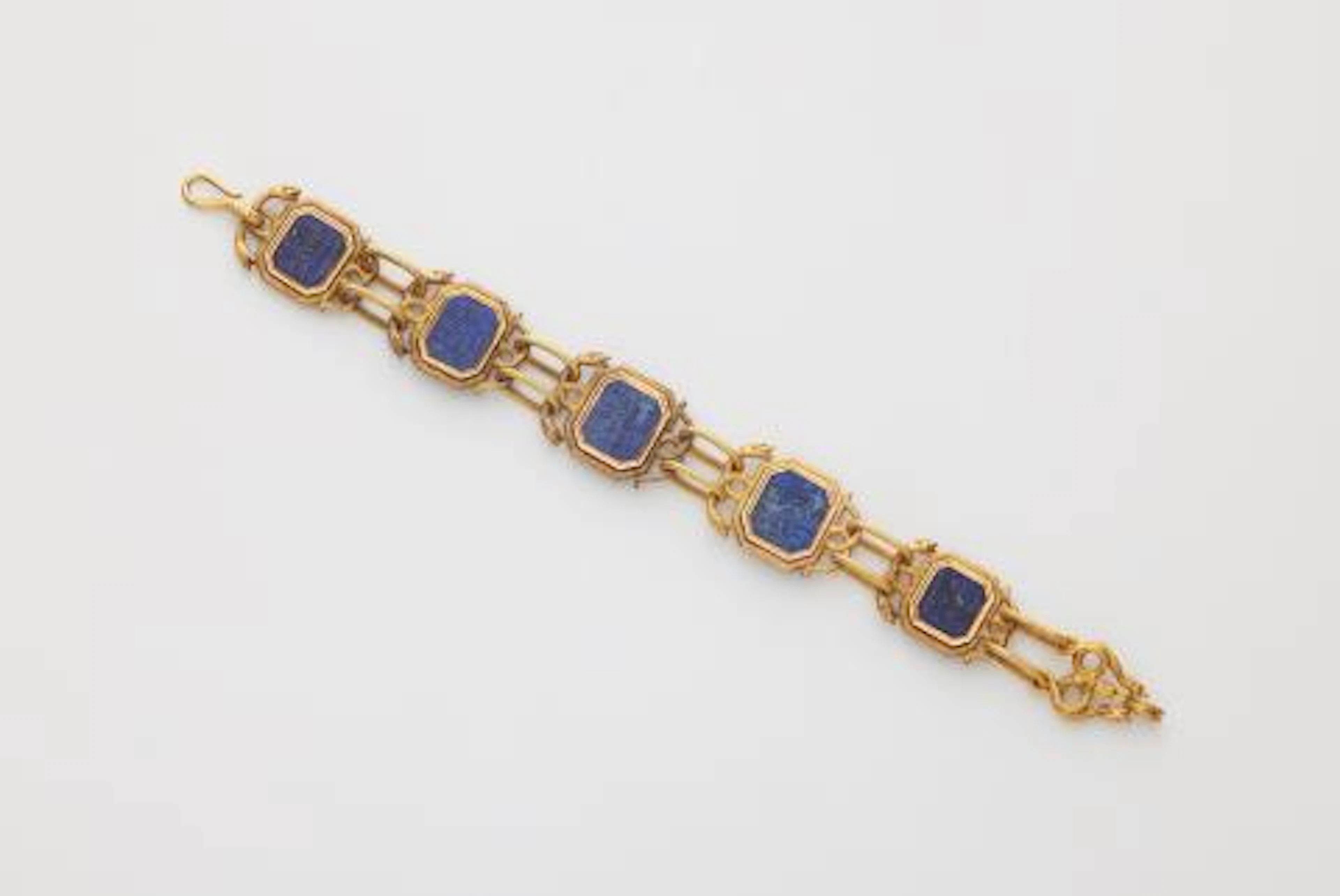 A Victorian 14k bicolour gold panel bracelet with Isalamic lapis lazuli