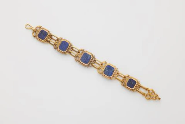 A Victorian 14k bicolour gold panel bracelet with Isalamic lapis lazuli