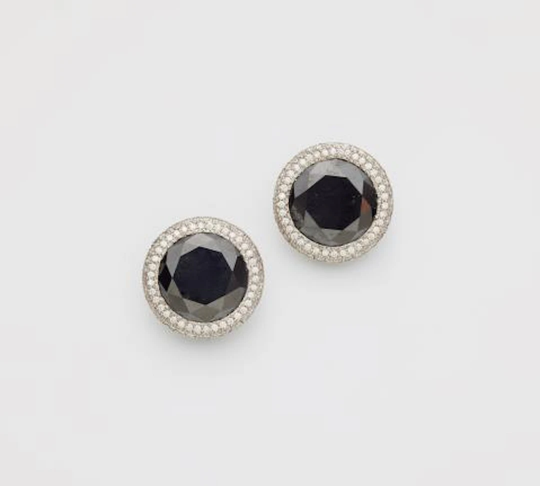 A pair of 18k white gold black & white diamond clip earrings.