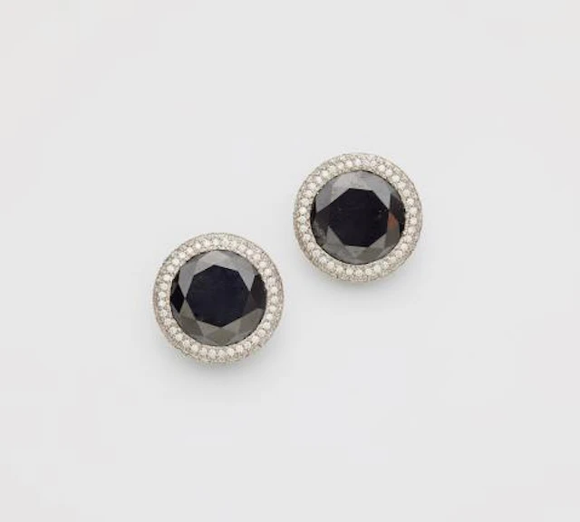 A pair of 18k white gold black & white diamond clip earrings.