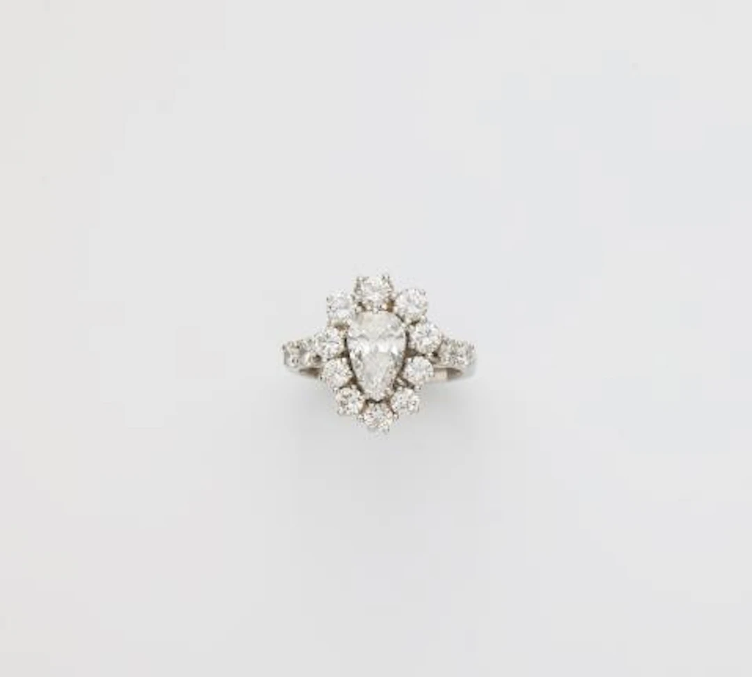 An 18k white gold and diamond cluster ring.