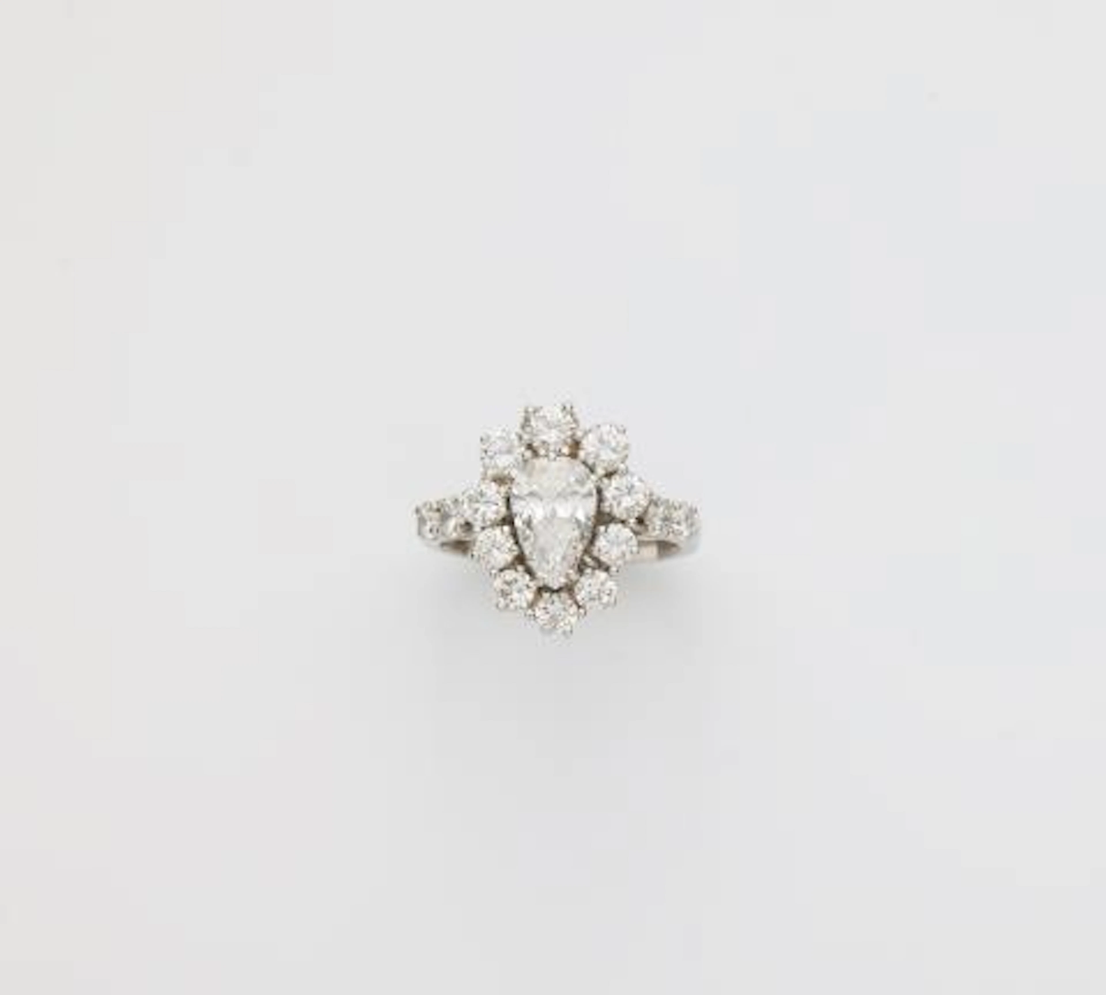 An 18k white gold and diamond cluster ring.