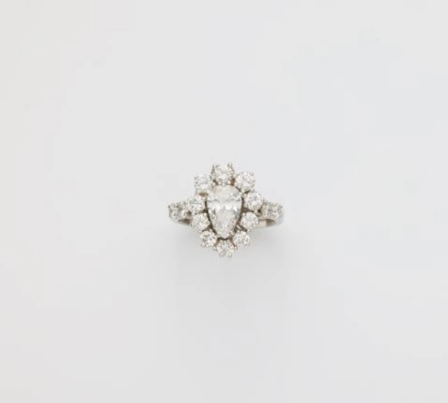 An 18k white gold and diamond cluster ring.