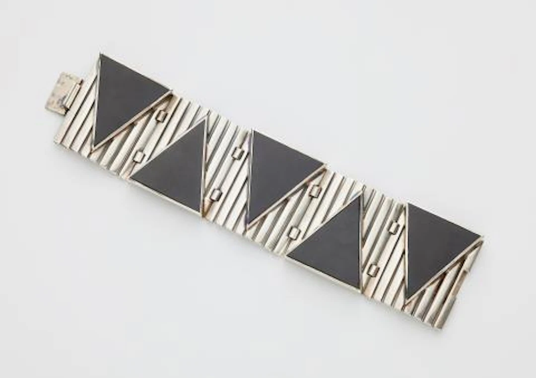 A French silver and triangular onyx panel Art Déco cuff bracelet.