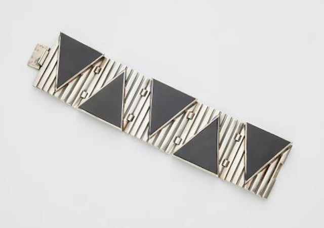 A French silver and triangular onyx panel Art Déco cuff bracelet.