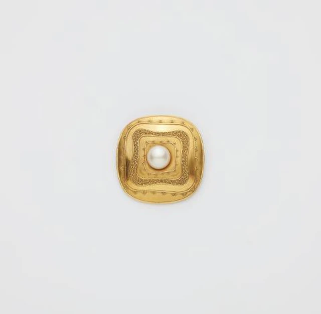 A German 18k gold granulation and cultured pearl buckle brooch.