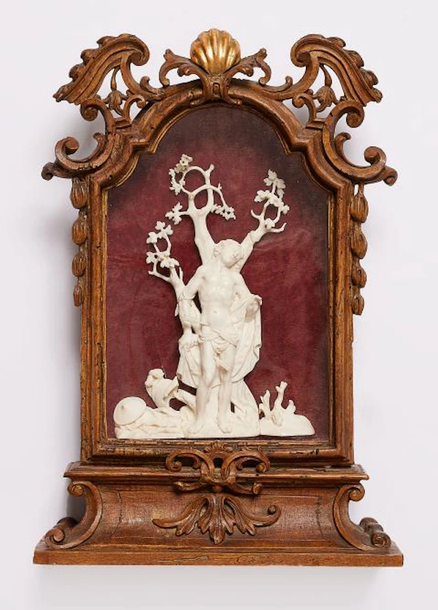 A small carved ivory shrine to St. Sebastian