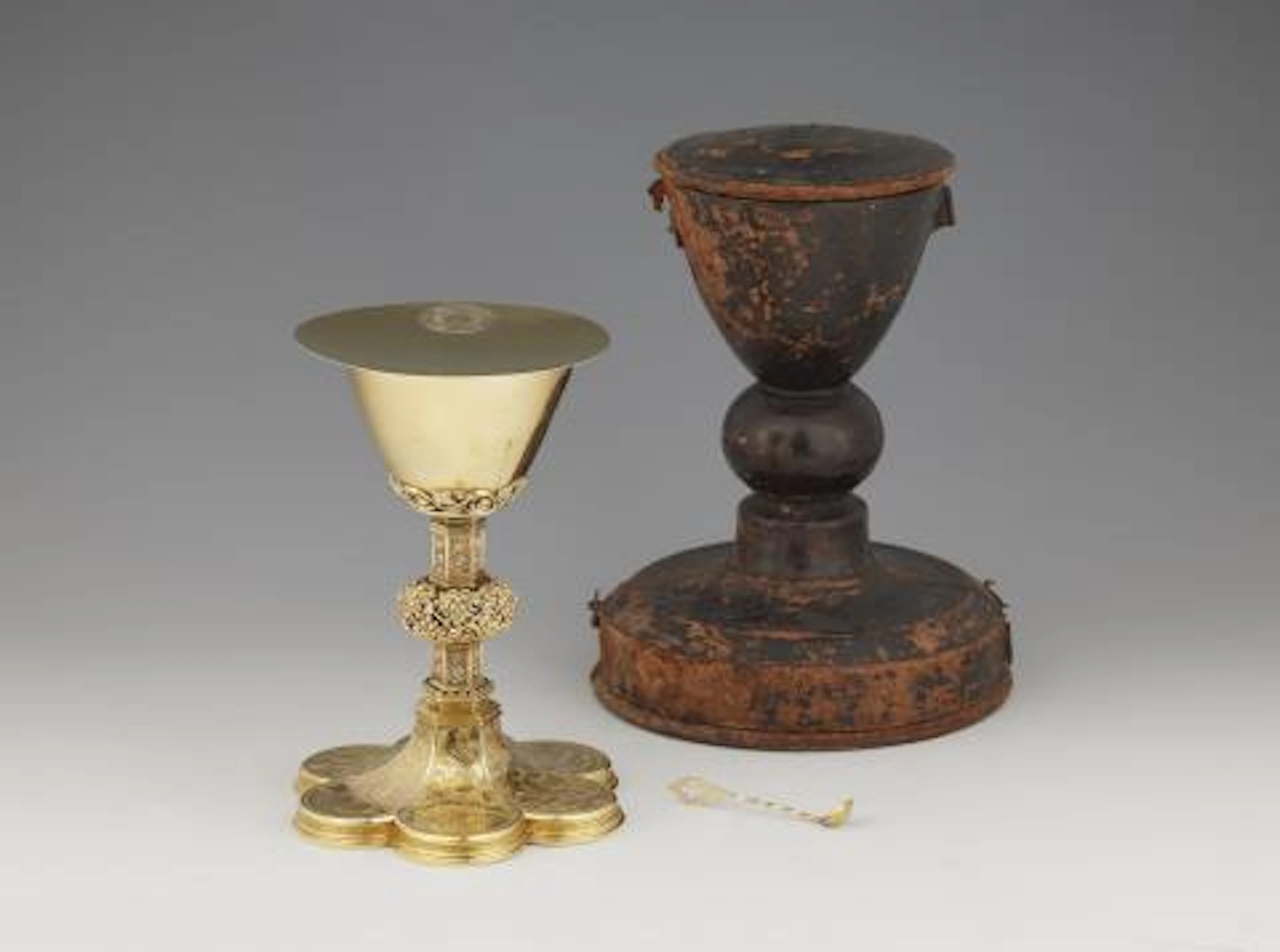 A silver-gilt communion chalice in a leather case