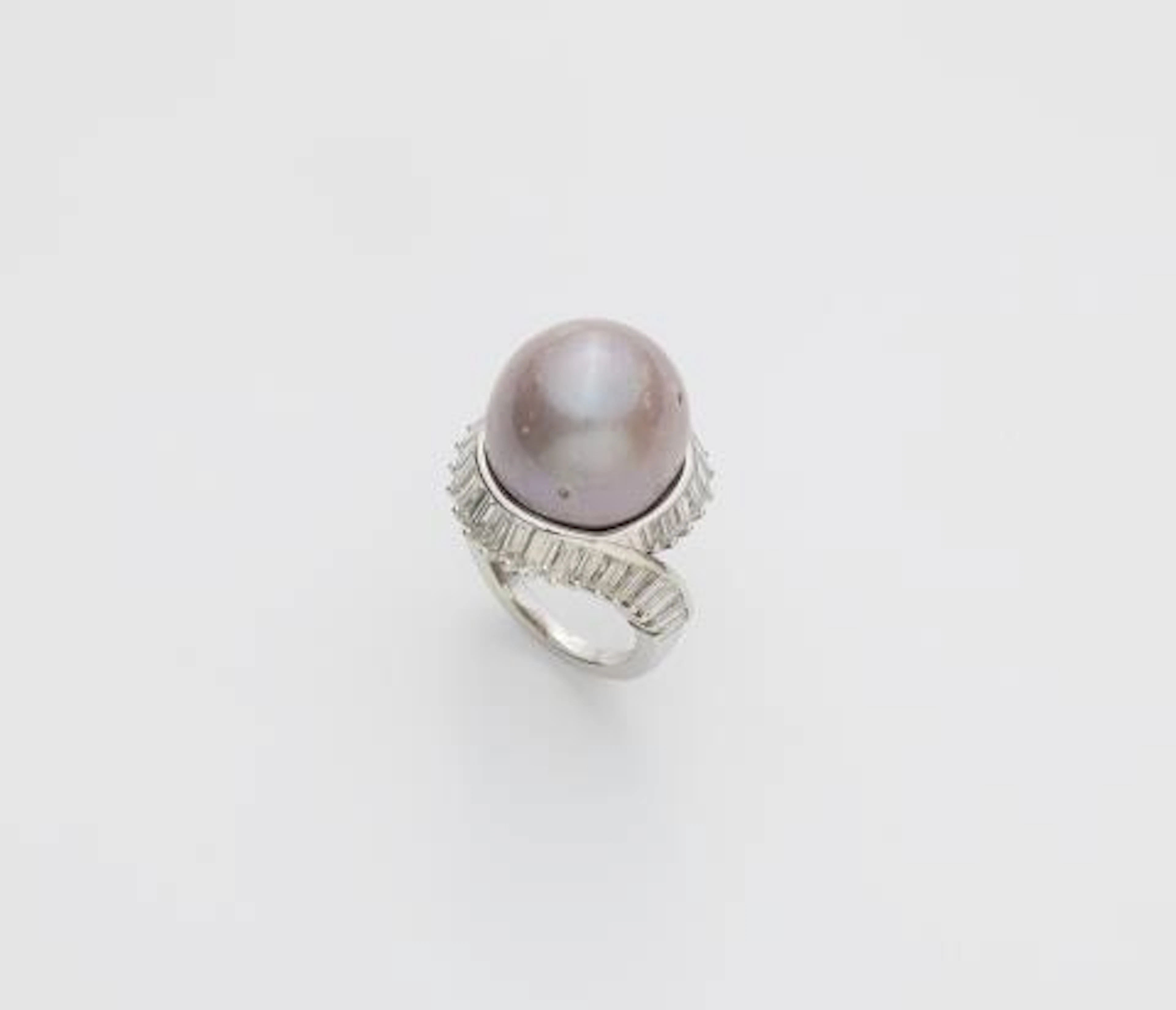 An 18k white gold, baguette-cut diamond and large brownish-greyish