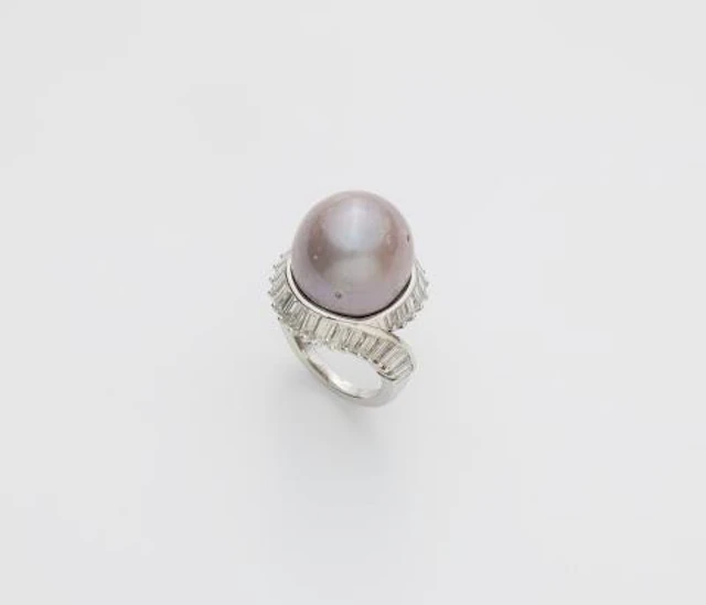 An 18k white gold, baguette-cut diamond and large brownish-greyish