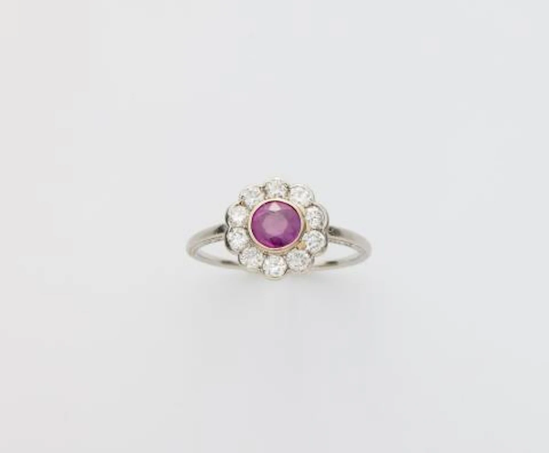 A platinum diamond and ruby Art Déco cluster ring.
