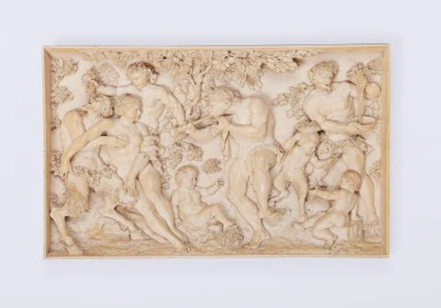 A carved ivory relief with dancing Maenads