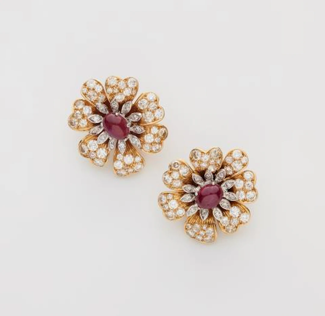 A pair of 18k yellow gold diamond and ruby clip earrings.