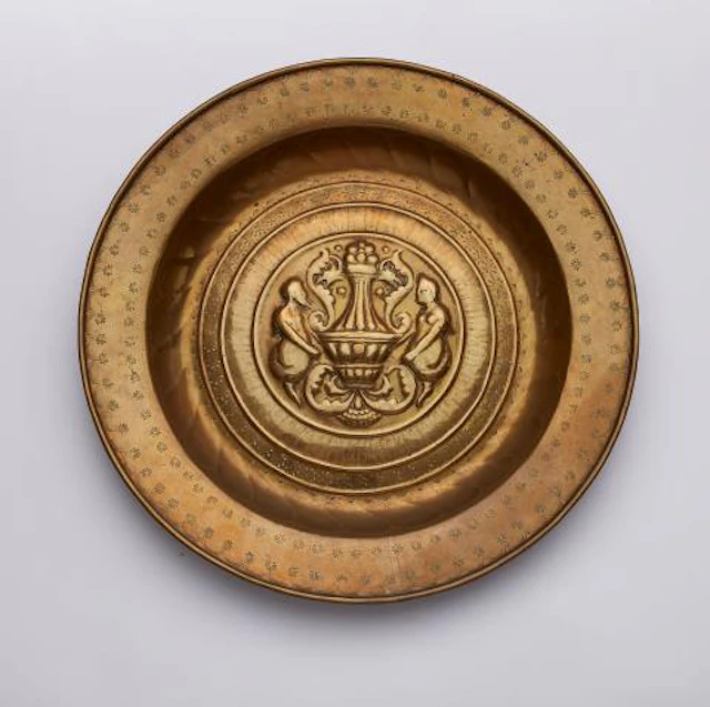 A brass 'Beckenschlägerschüssel' with two satyrs